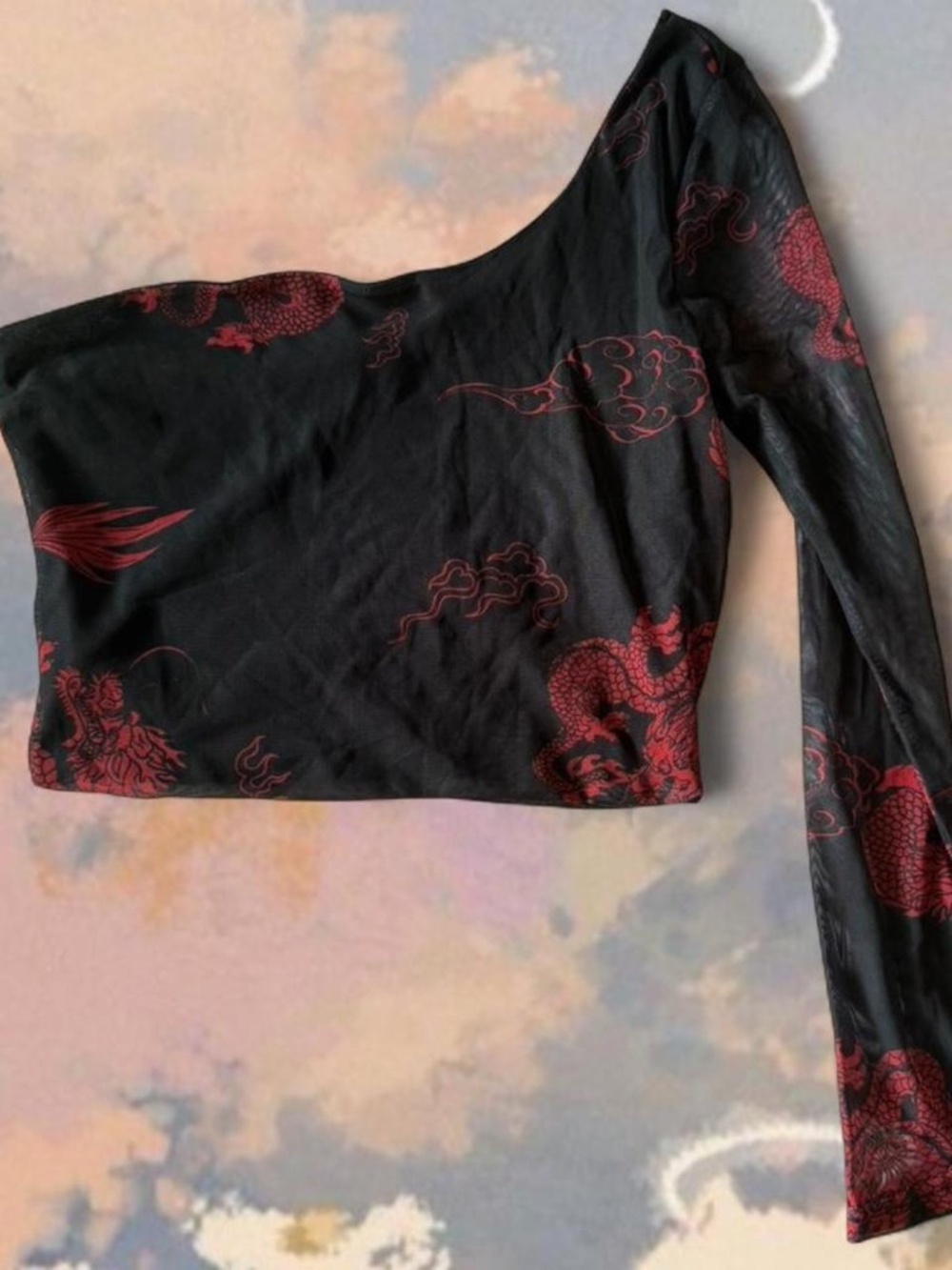Black and red one shoulder top with dragon design